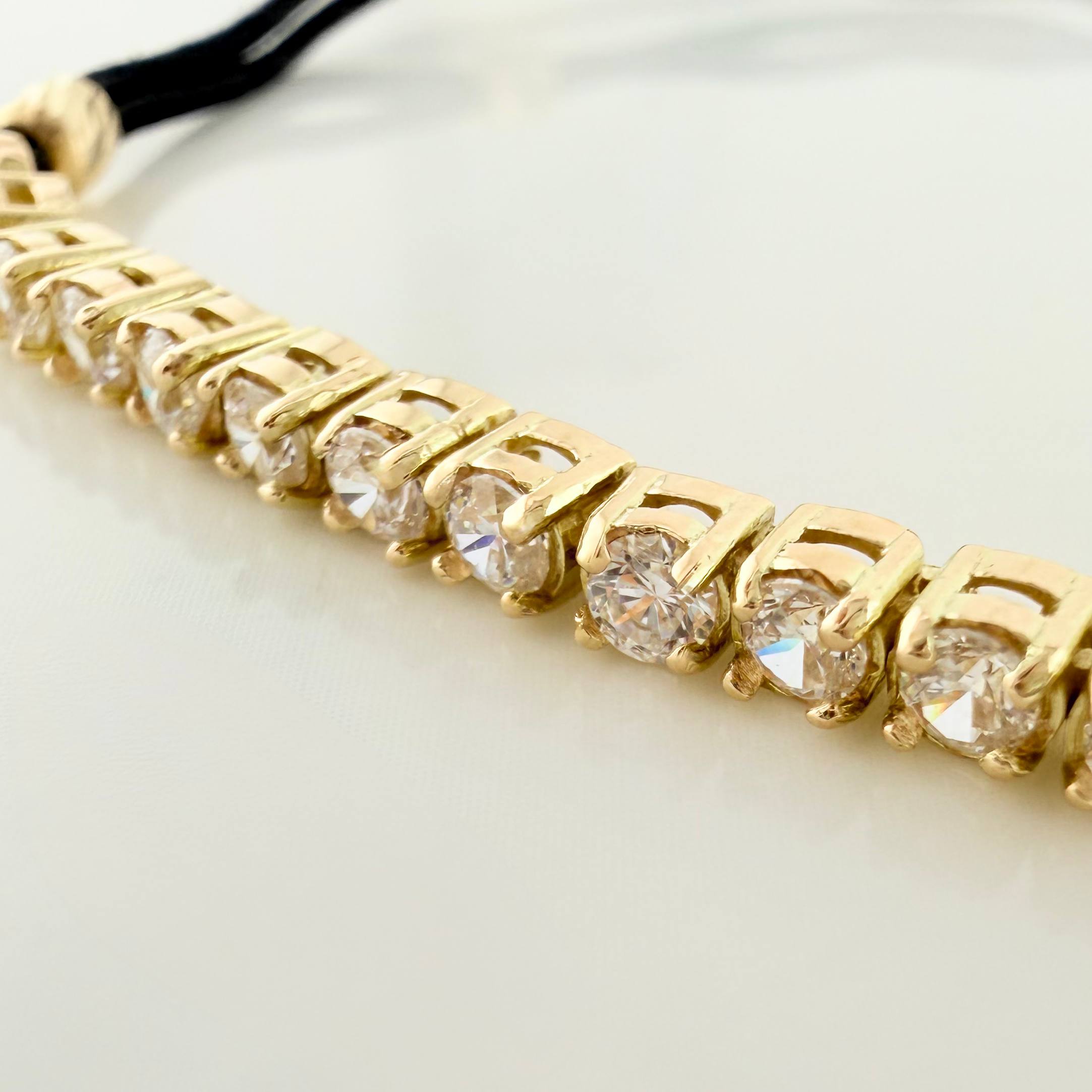 Pulsera Tejida Negra Tennis Oro Amarillo 18K
