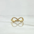 Anillo Silueta Infinito Basteado 1.3gr / T5 1/2 / Circones Blancos Oro Amarillo 18K