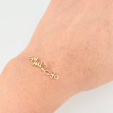 Herraje Corazon Electrocardiograma 0.8gr / 2.9cm / Oro Amarillo 18K