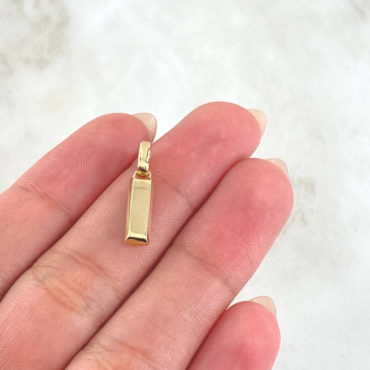Dije Lingote 1.25gr / 1.9cm / Nac.Esp.Oro 18K &