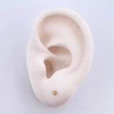 Topos Bisel 0.4gr / 2mm Circon Blanco Oro Amarillo 18K ©