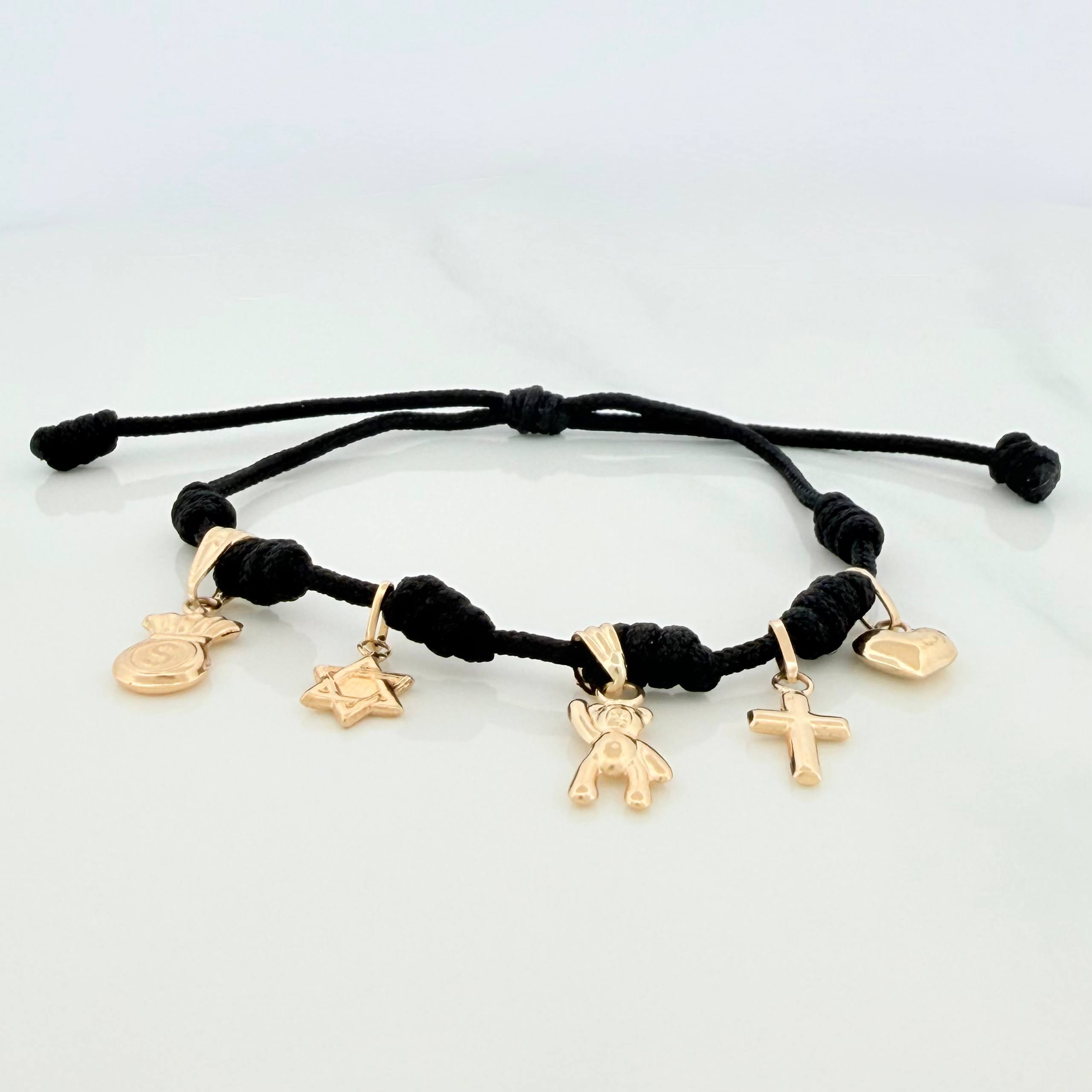 Pulsera Tejida Negra Seis Nudos Oro Amarillo 18K