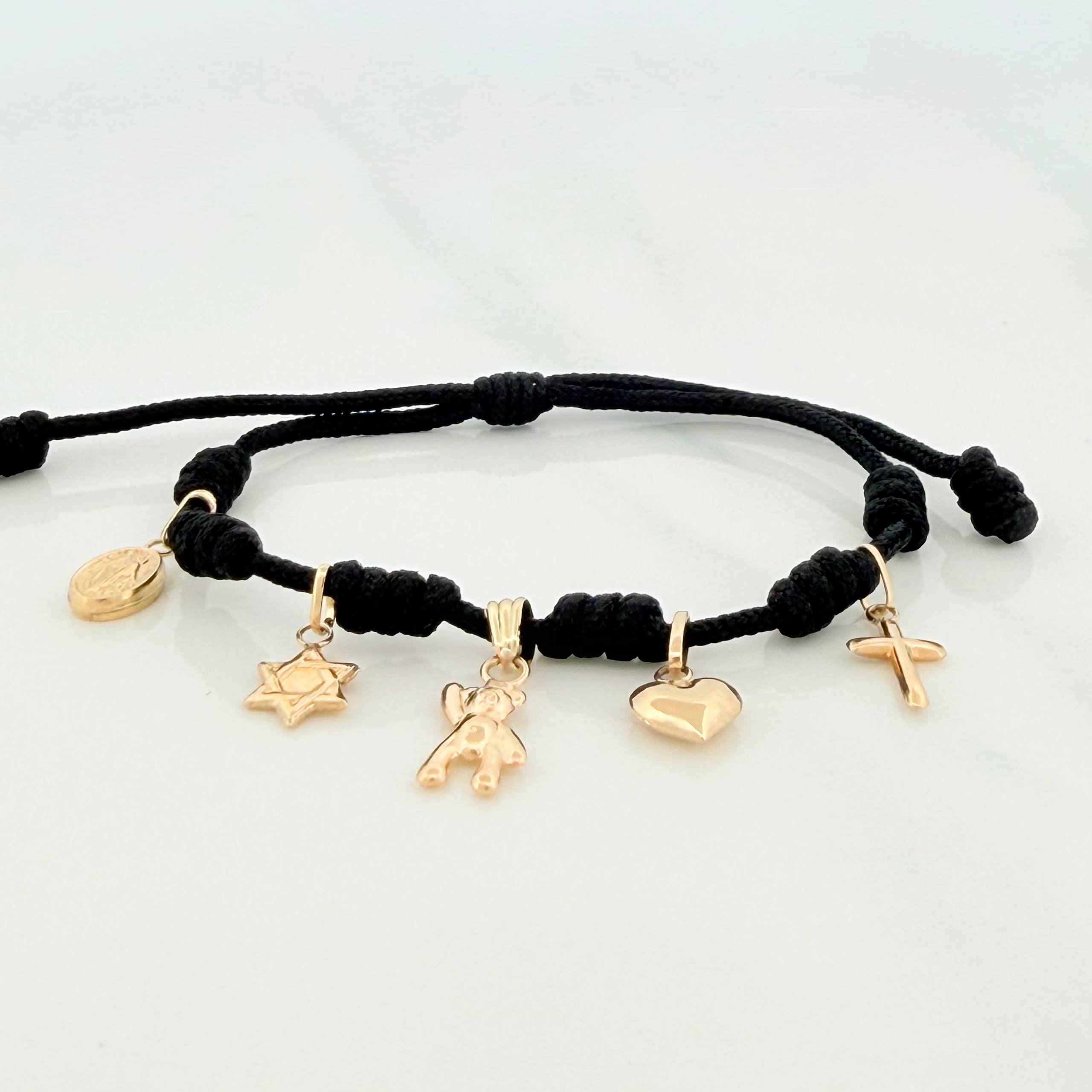 Pulsera Tejida Negra Seis Nudos Oro Amarillo 18K