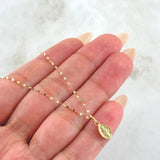Set Cadena y Dije Mini Flor Espejo + Virgen Milagrosa 0.65gr / Oro Amarillo 18K ©