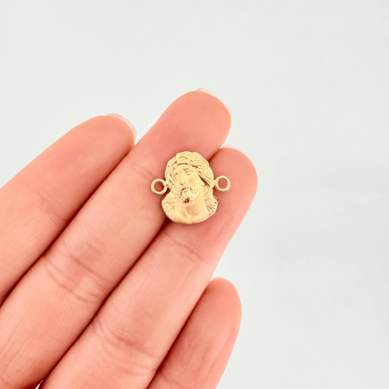 Herraje Rostro de Cristo 0.8g / 1.6cm Oro Amarillo 18K