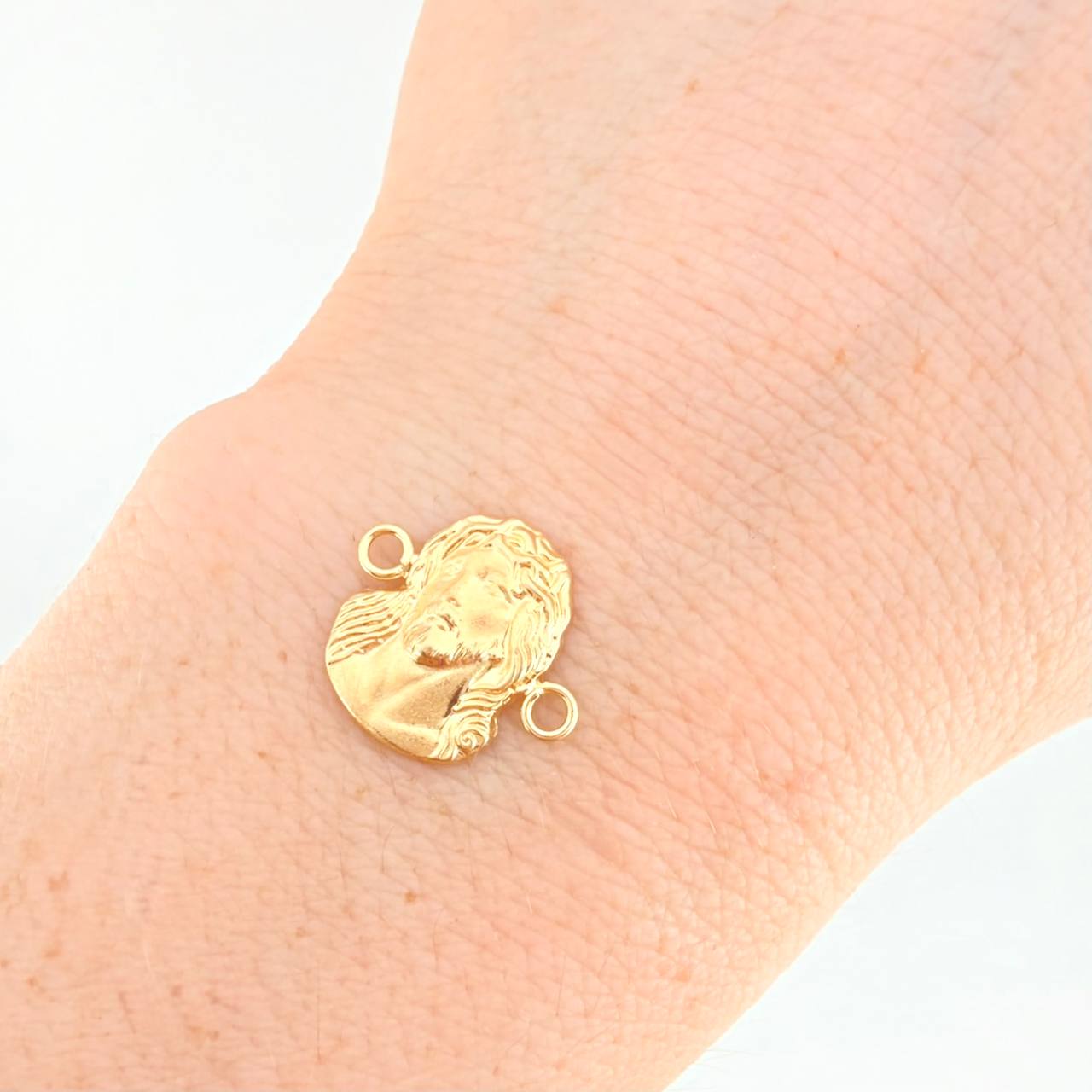 Herraje Rostro de Cristo 0.8g / 1.6cm Oro Amarillo 18K