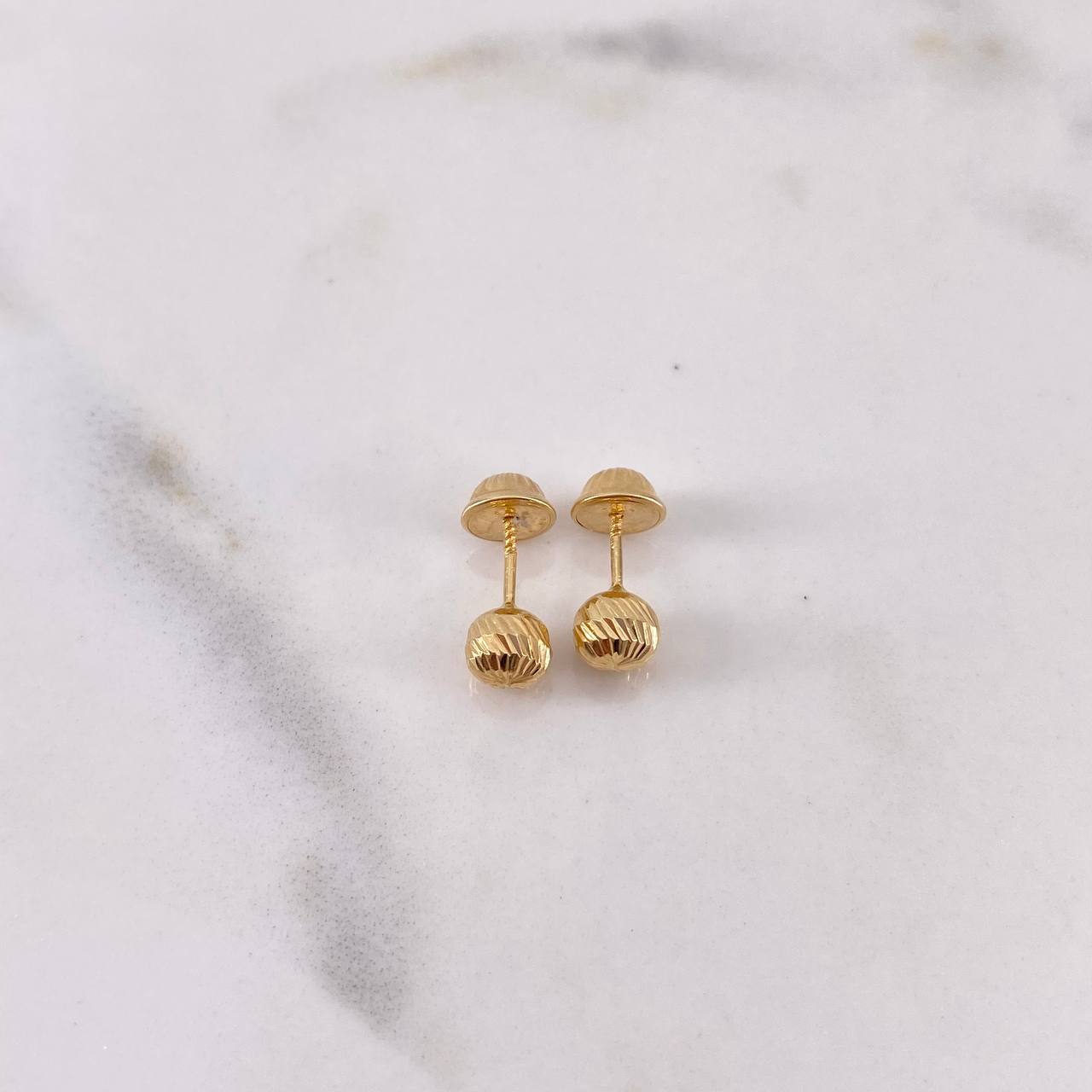 Topos Bola 0.55gr / 5mm Diamantadas Oro Amarillo 18K $
