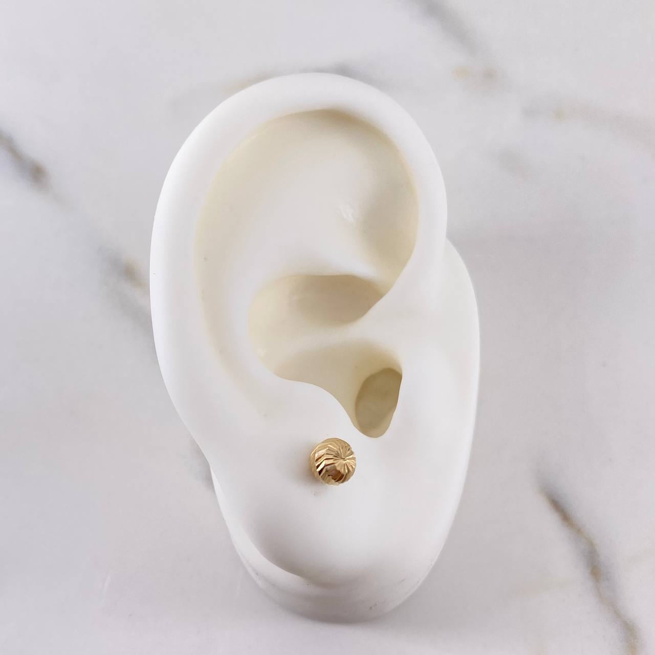 Topos Bola 0.55gr / 5mm Diamantadas Oro Amarillo 18K $
