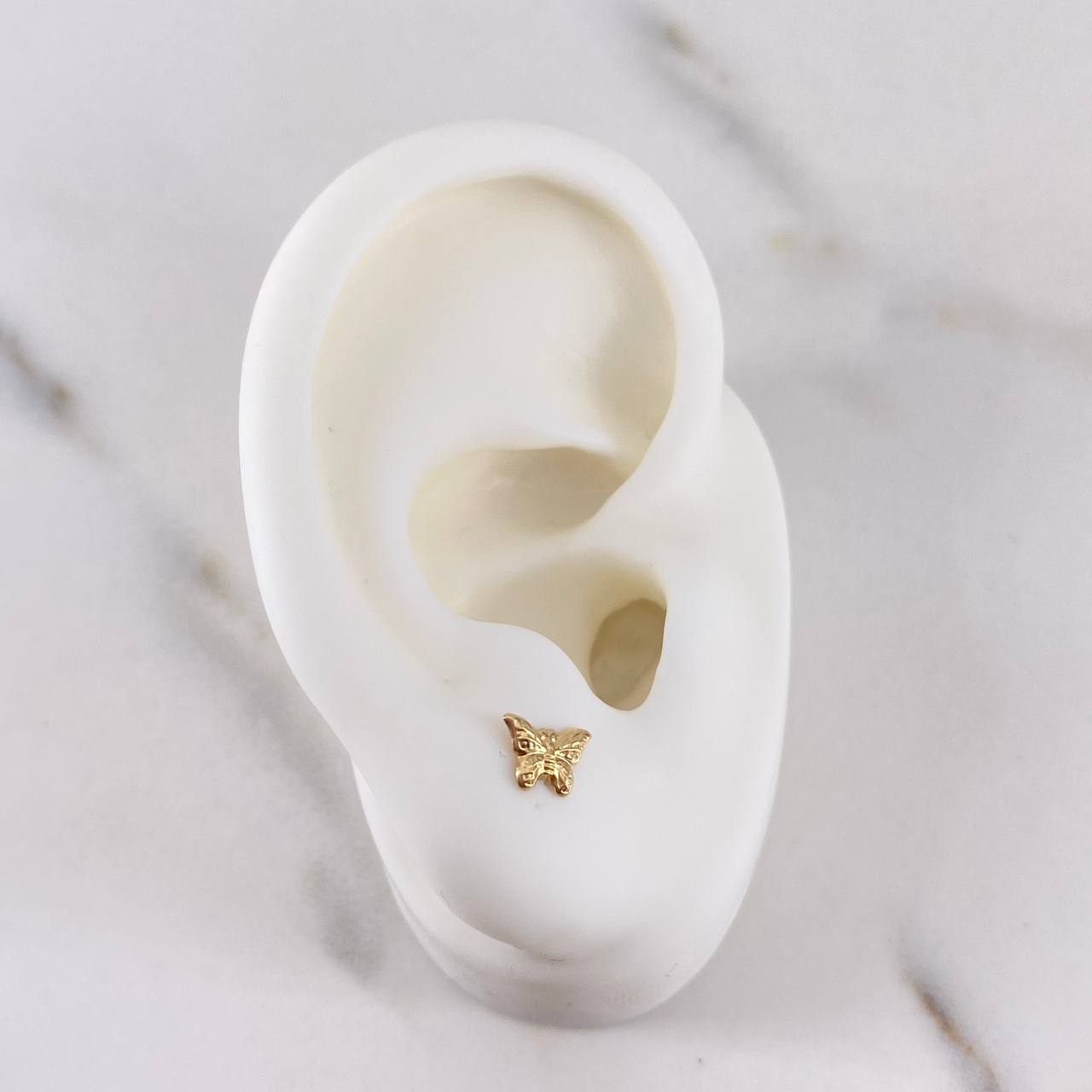 Topos Mariposa 0.45gr / Lisos Oro Amarillo 18K $