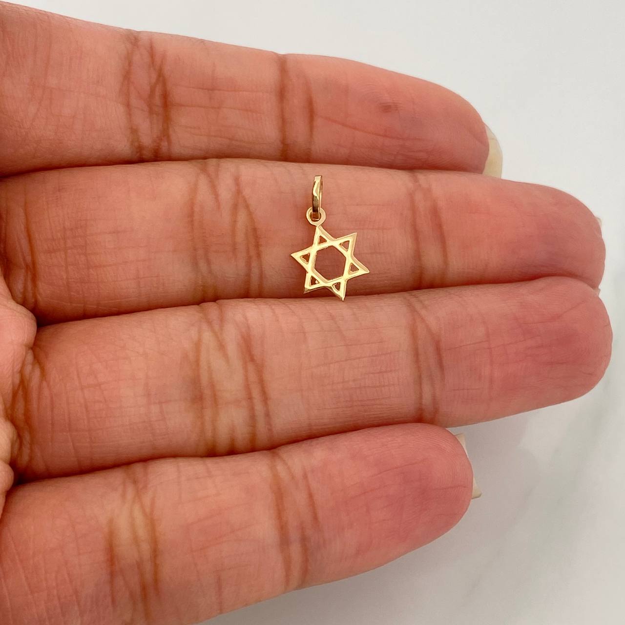 Dije Estrella de David 0.2gr / 1.4cm / Oro Amarillo 18K %