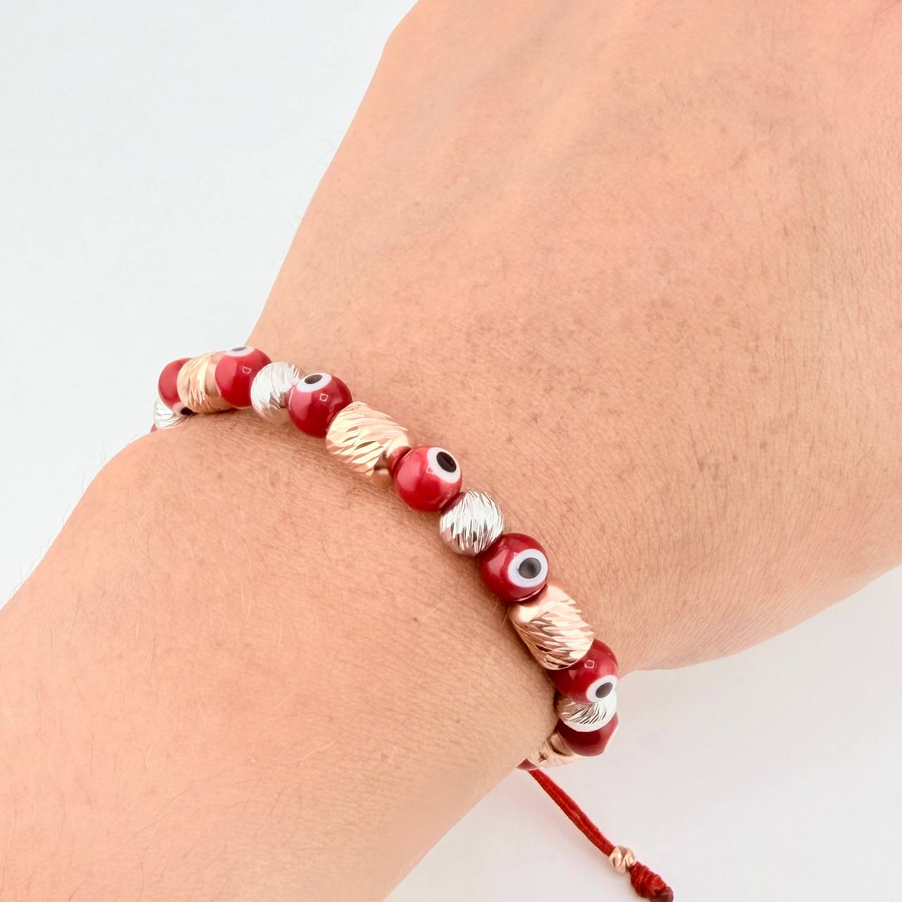 Pulsera Tejida Ojos Turcos Cilindros 6Mm Dos Oros Blanco Rosa 18K