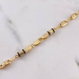 Cadena Rustica Corona RX 12.15gr / 62.9cm / 3.8mm Cauchos Negros Oro Amarillo 18K $