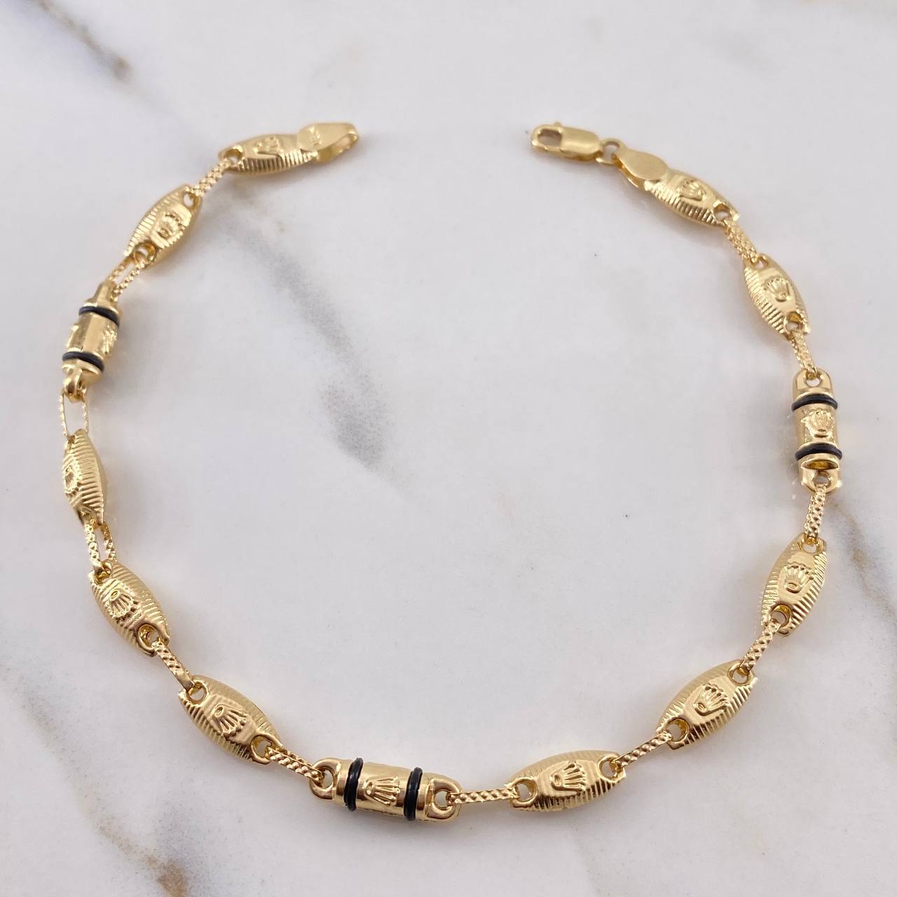 Pulso Rustico Corona RX 4.75gr / 21.7cm / 4.5mm Cauchos Negros Oro Amarillo 18K $