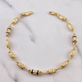 Pulso Rustico Corona RX 4.75gr / 21.7cm / 4.5mm Cauchos Negros Oro Amarillo 18K $