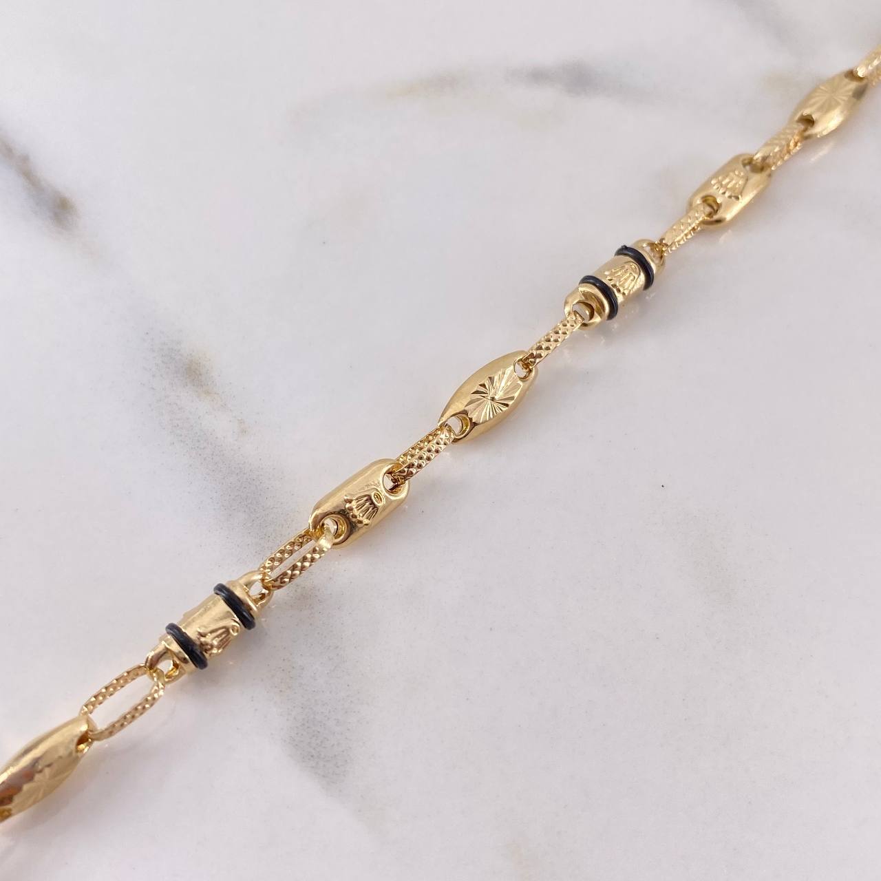 Tobillera Rustica Corona RX 5.3gr / 24.6cm / 3.7mm Eslabon Diamantado Caucho Negro Oro Amarillo 18K $