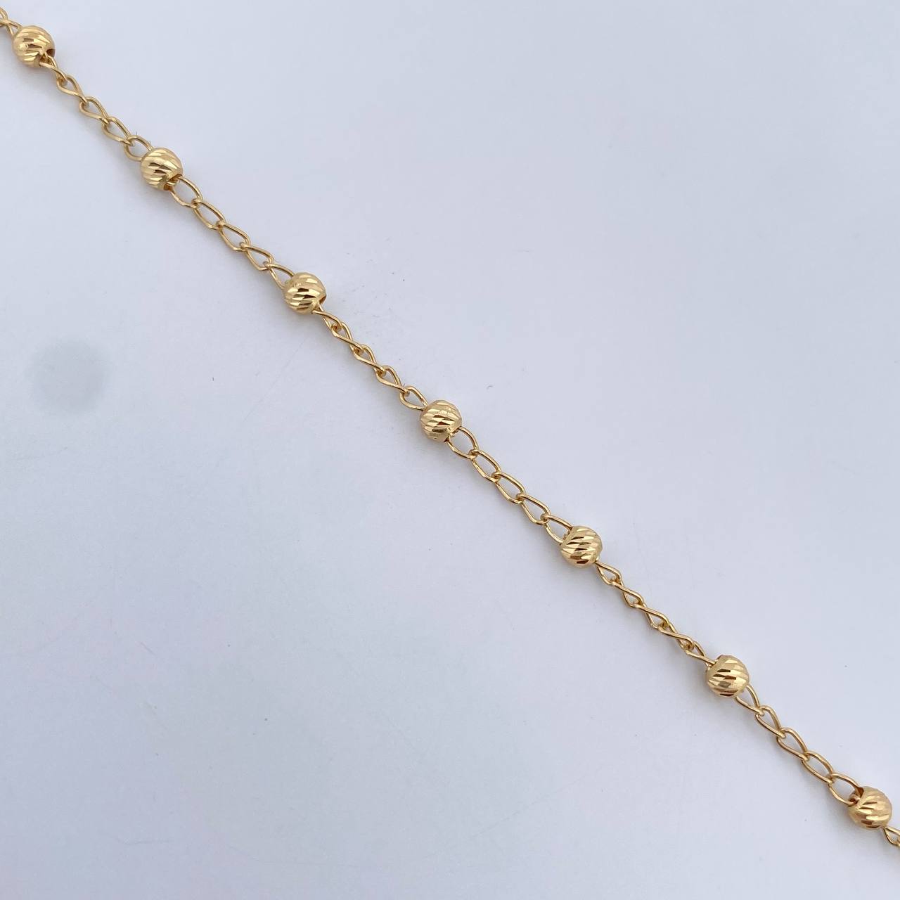 Pulso Tipo Militar Espiga 1.8gr / 18.2cm / 3mm Bolas Diamantadas Oro Amarillo 18K $