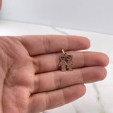 Dije Niño-Niña 1.65gr / 2.2cm / Circones Blancos Negros Oro Rosa 18K $