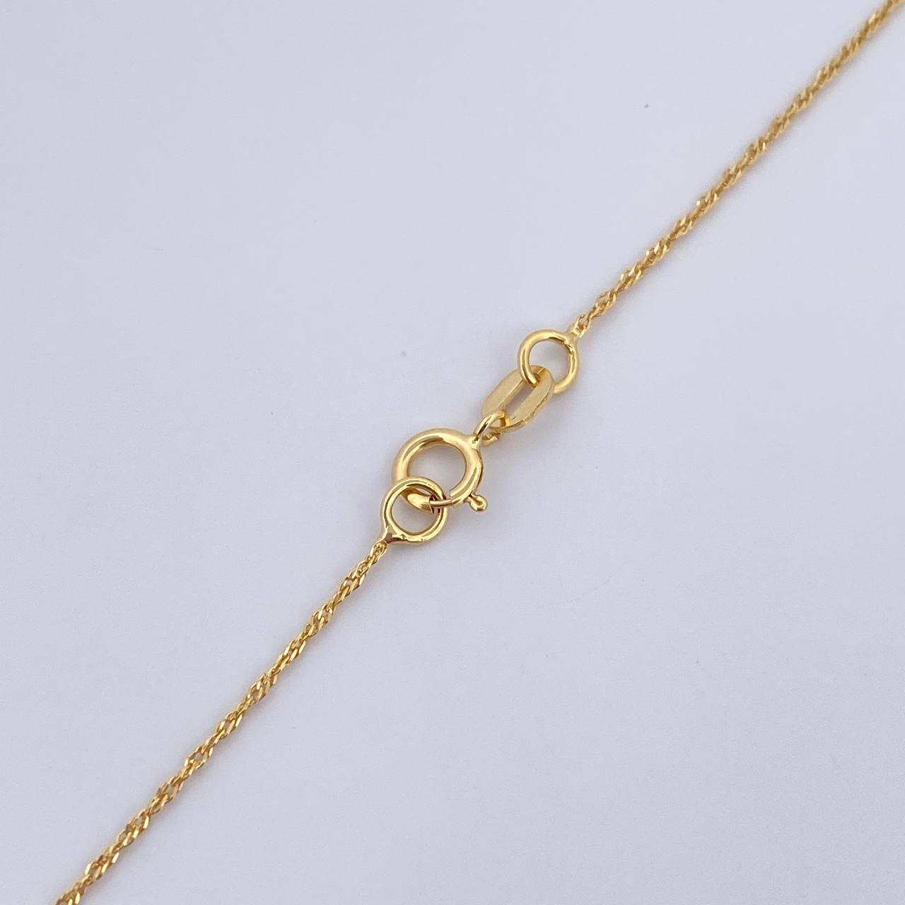 Set Cadena Singapur 1.15gr/50cm/0.8mm + Dije Divino Niño 0.3gr/ 1.4cm Troquelado Oro 18K (Oferta) &