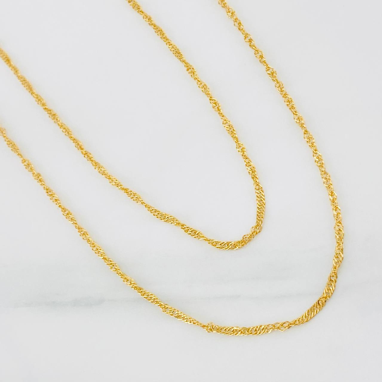 Cadena Singapur 2.7g / 60cm / 1.5mm Oro Amarillo 18K