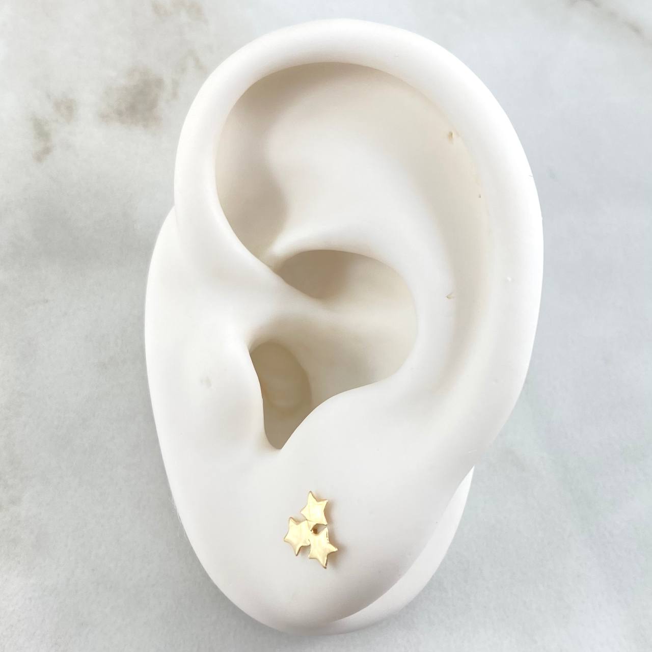 Topos Trio Estrellas 0.6gr / Oro 18K *