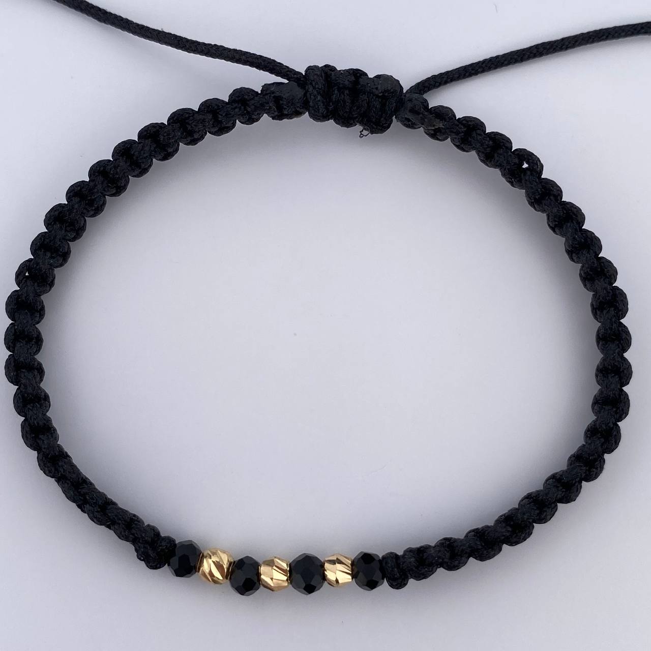 Pulsera Negra Rondela 0.15gr / Oro 18K &