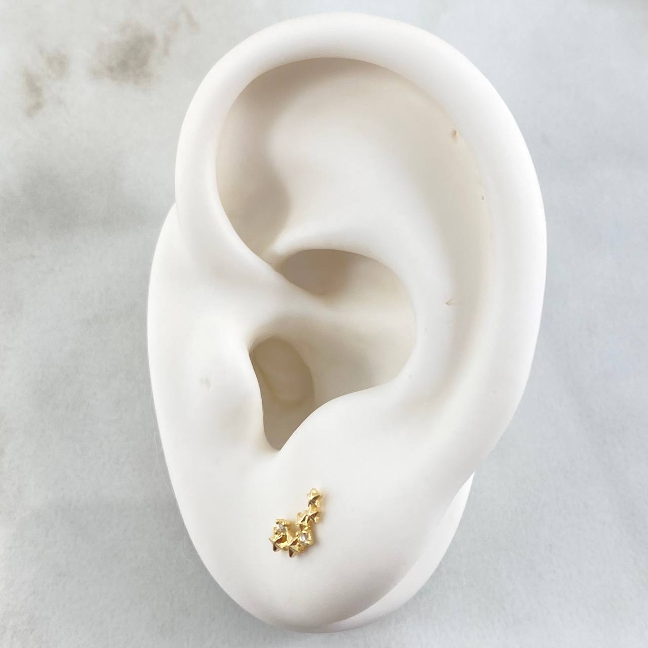 Topos Estrellas 0.65gr / Oro 18K ©
