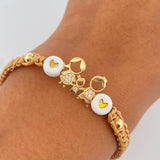 Pulsera Beige Herraje Familia 1.2gr / Oro 18K $