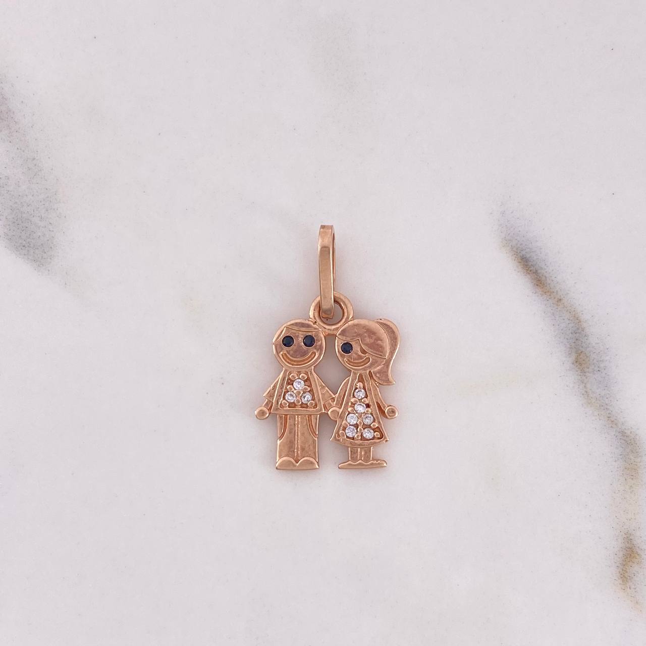 Dije Niño-Niña 1.65gr / 2.2cm / Circones Blancos Negros Oro Rosa 18K $