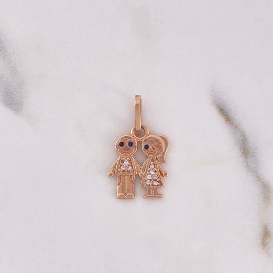 Dije Niño-Niña 1.65gr / 2.2cm / Circones Blancos Negros Oro Rosa 18K $