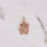 Dije Niño-Niña 1.65gr / 2.2cm / Circones Blancos Negros Oro Rosa 18K $