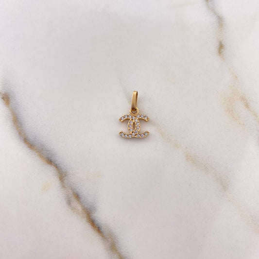 Dije Ola Cruzada 0.45gr / 1.3cm / Circones Blancos Oro Amarillo 18K $