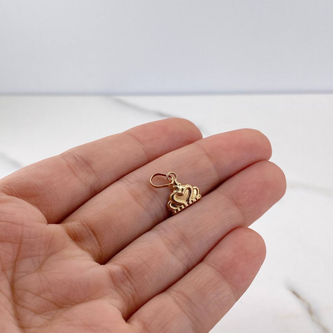 Dije Corona Corazon 0.45gr / 1.3cm / Plano Oro Amarillo 18K $