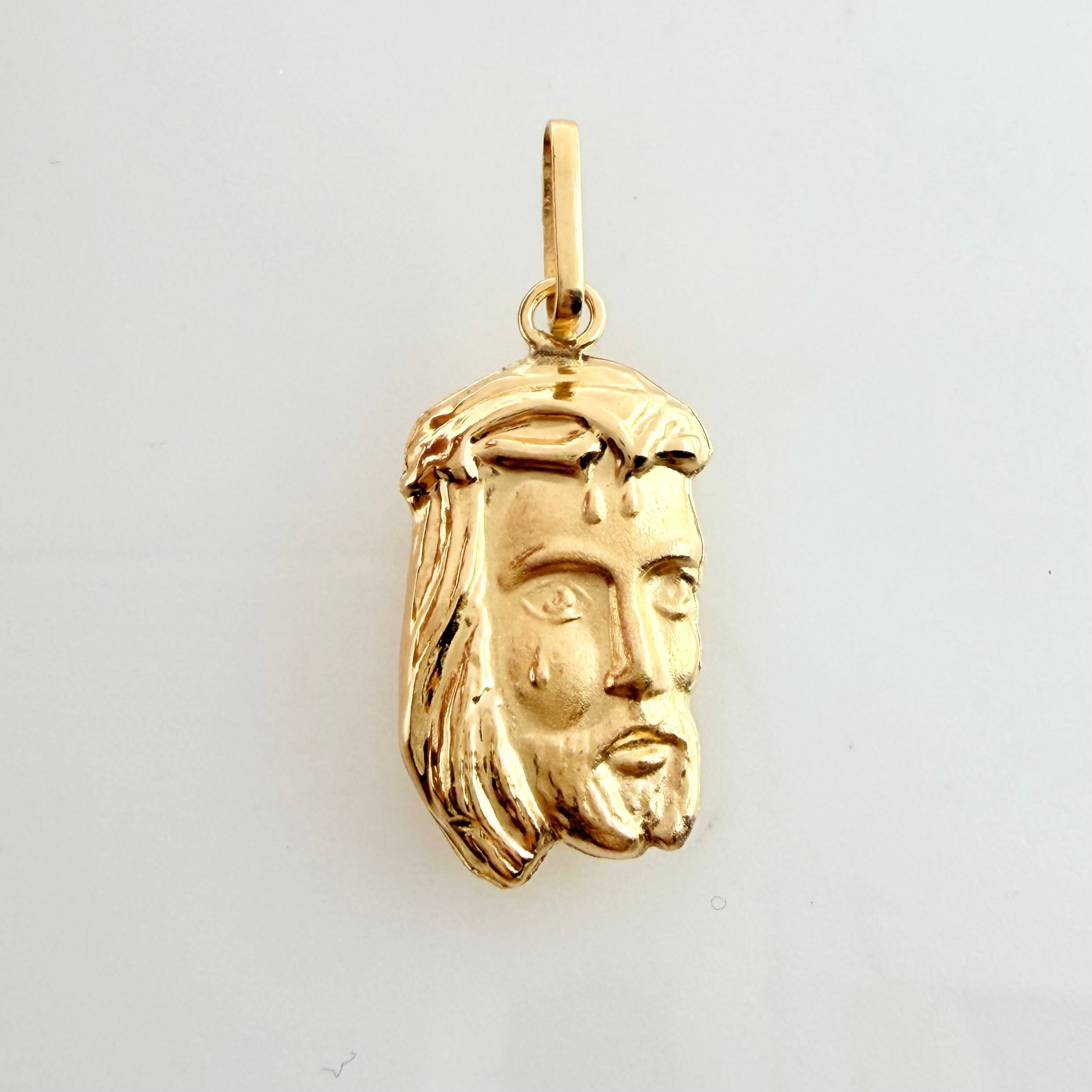 Dije Rostro Cristo 0.85gr / 2.4cm / Oro Amarillo 18K ©