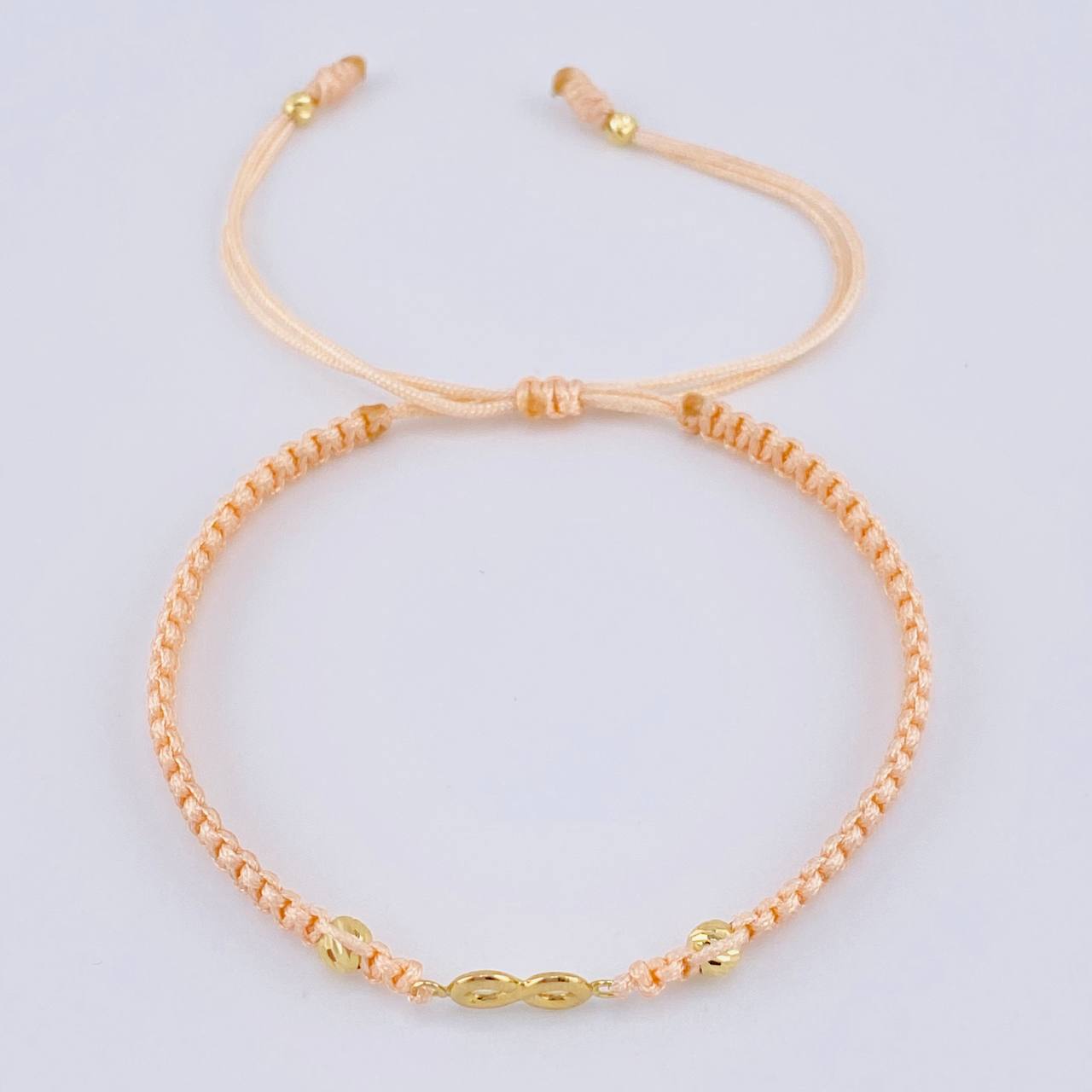 Pulsera Tejida Rosa Infinito Bolas Diamantadas Oro Amarillo 18K
