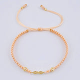 Pulsera Tejida Rosa Infinito Bolas Diamantadas Oro Amarillo 18K