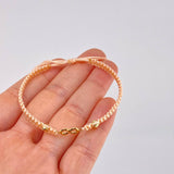 Pulsera Tejida Rosa Infinito Bolas Diamantadas Oro Amarillo 18K