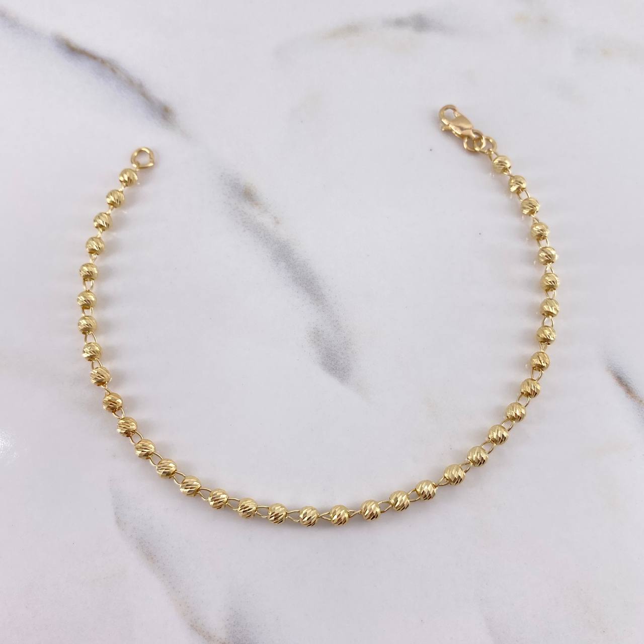 Pulso Tipo Militar 2.85gr / 18cm / 2.7mm Bolas Diamantadas Oro Amarillo 18K $