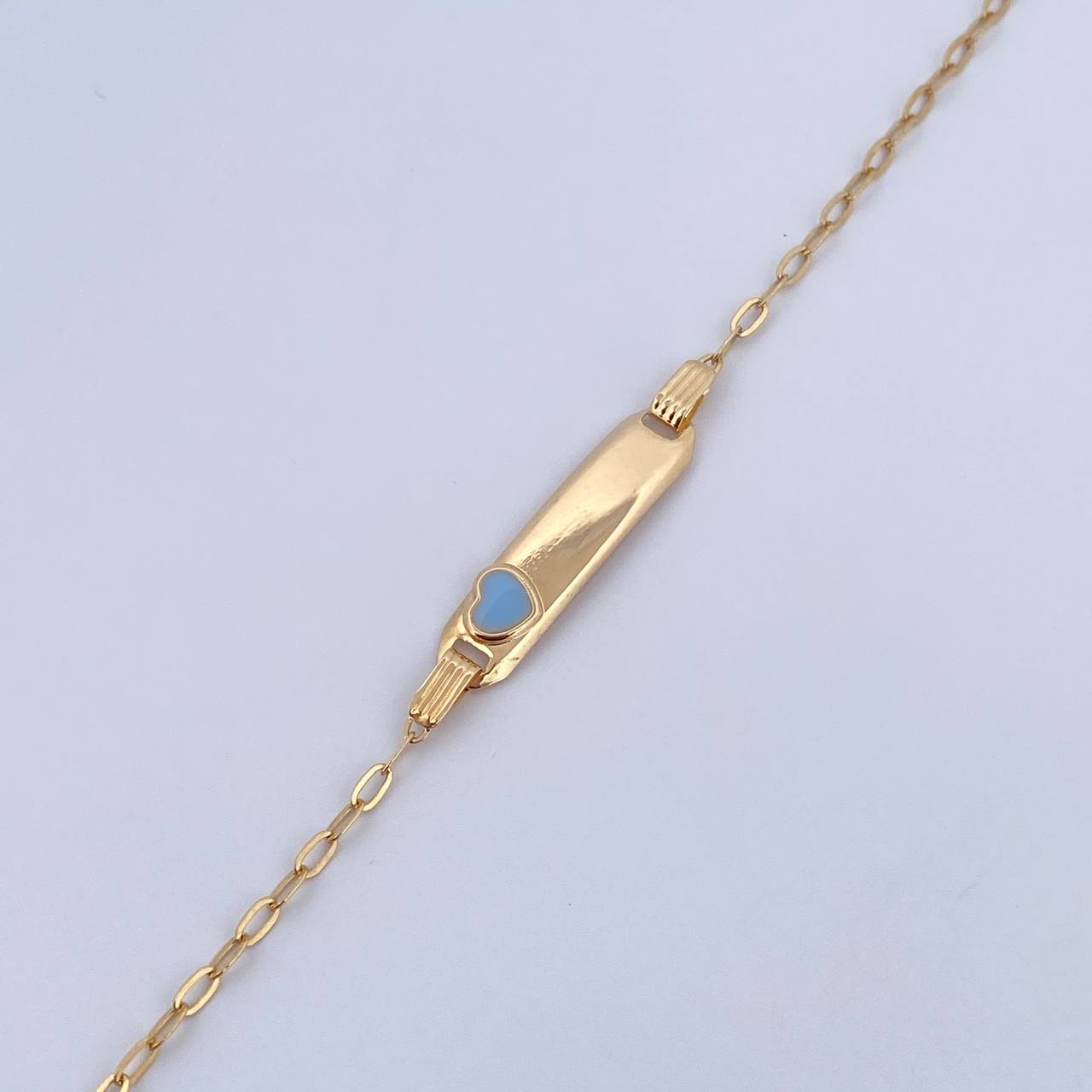 Pulso Bebé Cajon Corazon Celeste 1.4gr / 13.4cm-14.5cm / 1.7mm Placa Rectangular Curva Oro Amarillo 18K $