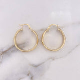 Candongas Nia 4.2gr / 2.9cm / Matizadas Oro Amarillo 18K $