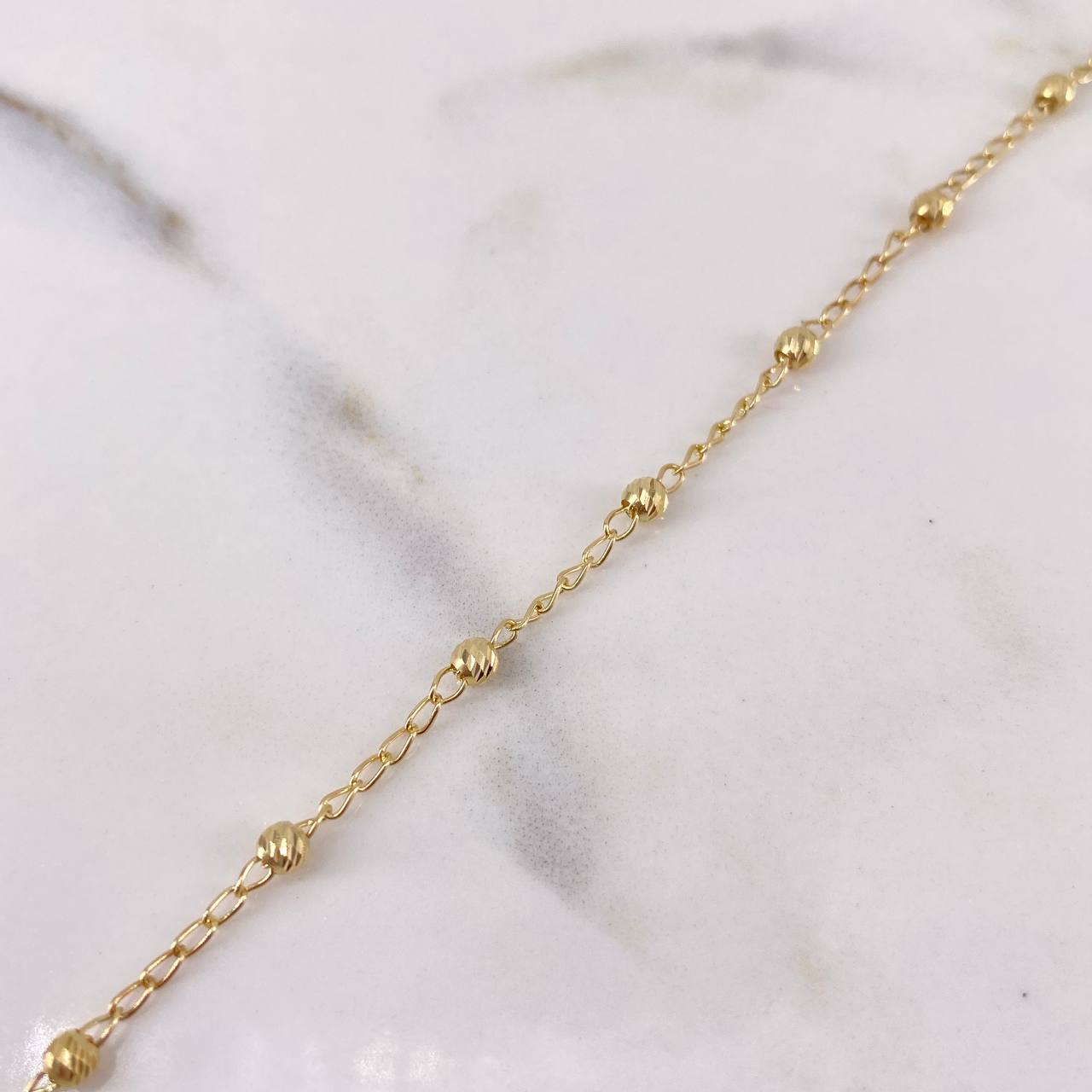 Pulso Tipo Militar 1.8gr / 18cm / 2.6mm Bolas Diamantadas Oro Amarillo 18K $