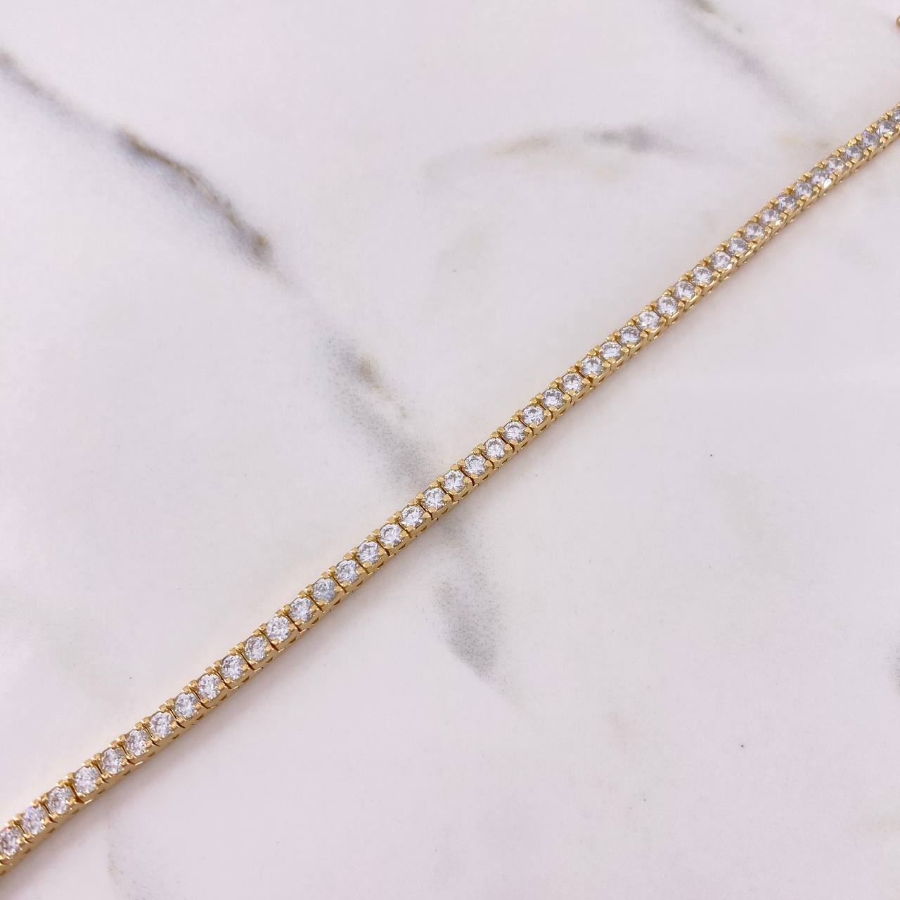 Pulso Tennis 12.35gr / 18cm / Circones Blancos Oro Amarillo 18K $