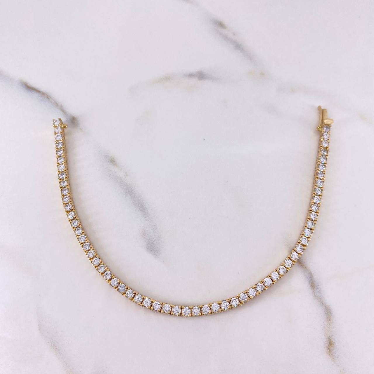 Pulso Tennis 12.35gr / 18cm / Circones Blancos Oro Amarillo 18K $