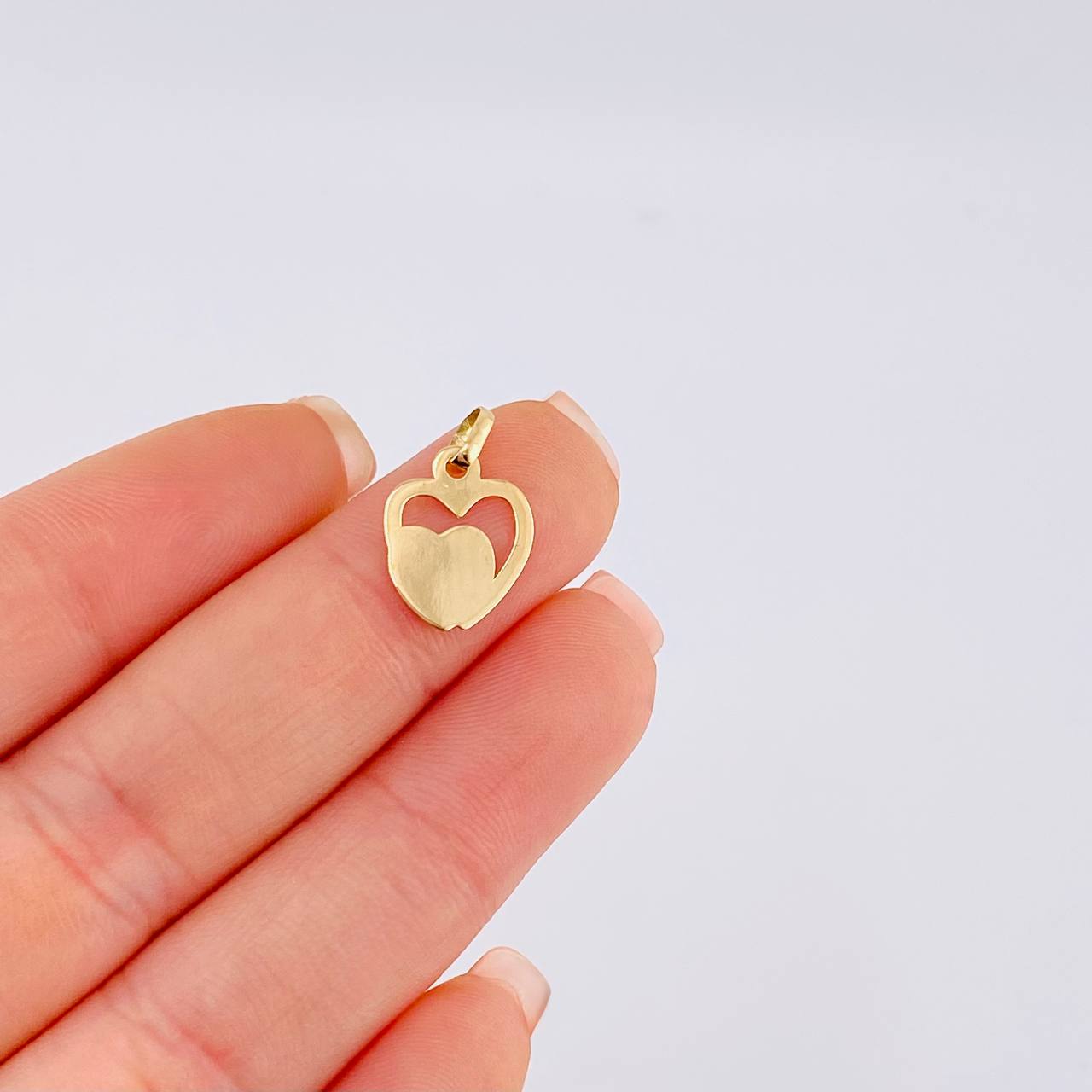 Dije Corazones Unidos 0.55 g / 1.8 cm Oro Amarillo 18K