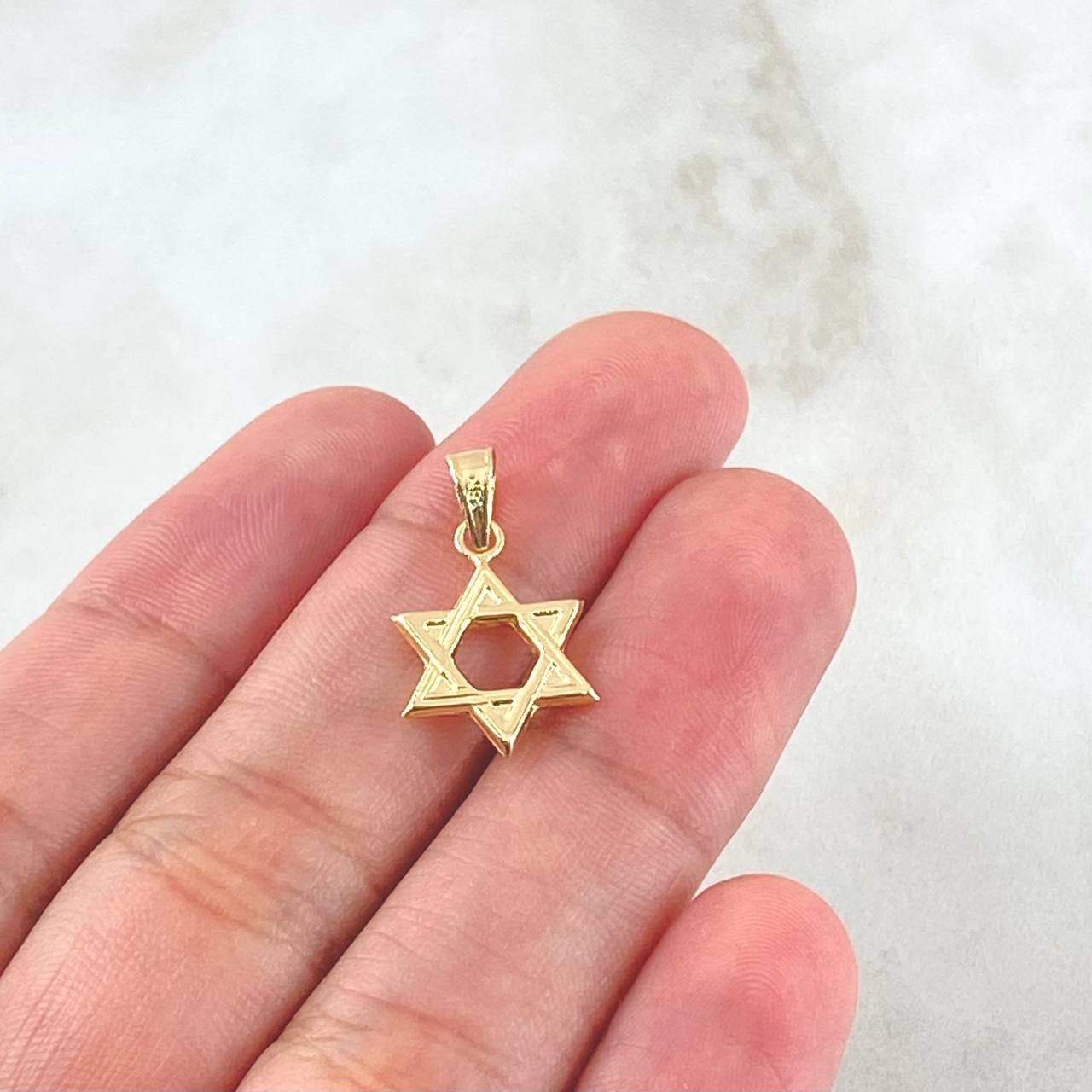 Dije Estrella De David 0.6gr / 2cm / Oro 18K ©