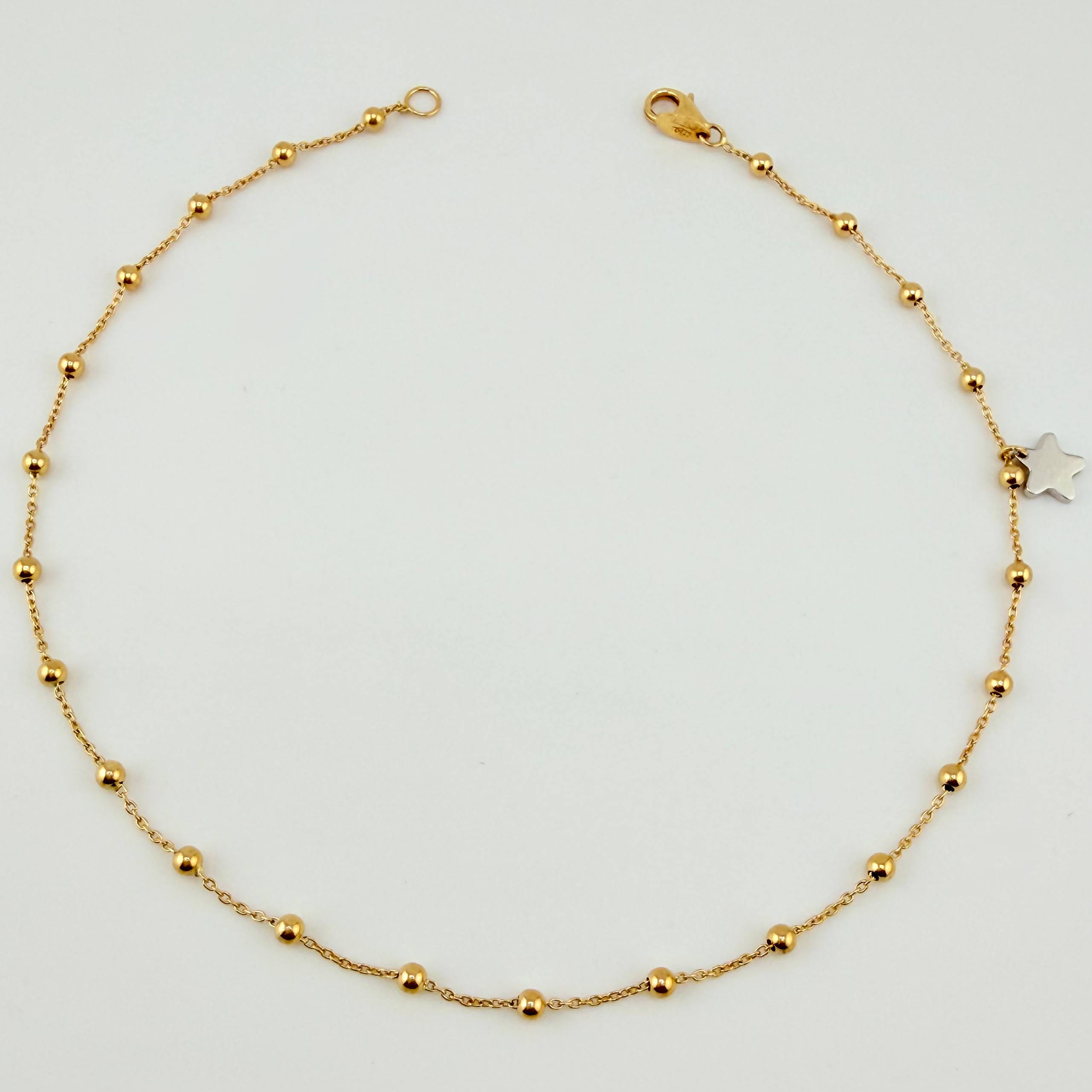 Tobillera Aro Seguido Dije Estrella 2.45gr / 25cm / 2.3mm Dos Oros Amarillo Blanco +4 18K