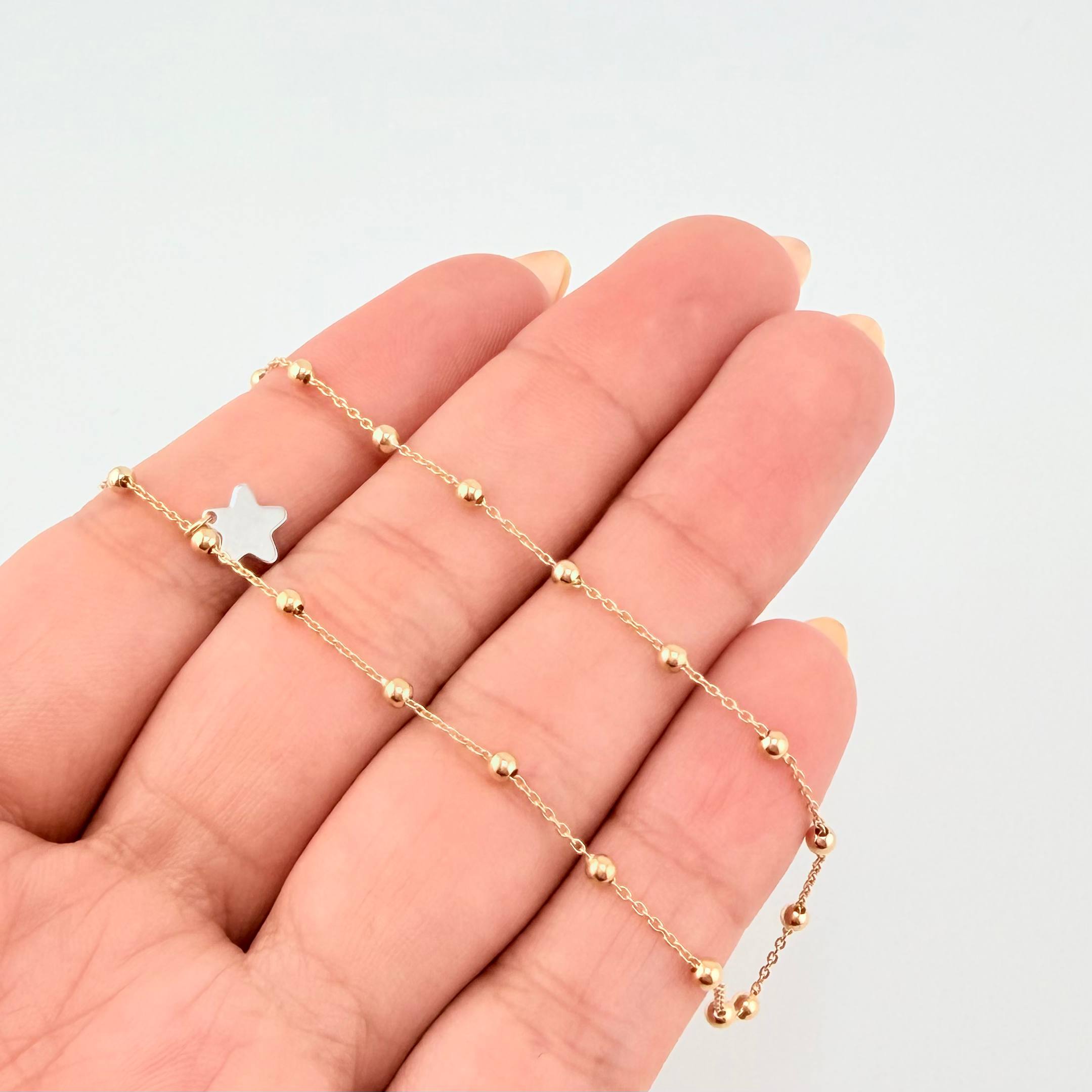 Tobillera Aro Seguido Dije Estrella 2.45gr / 25cm / 2.3mm Dos Oros Amarillo Blanco +4 18K