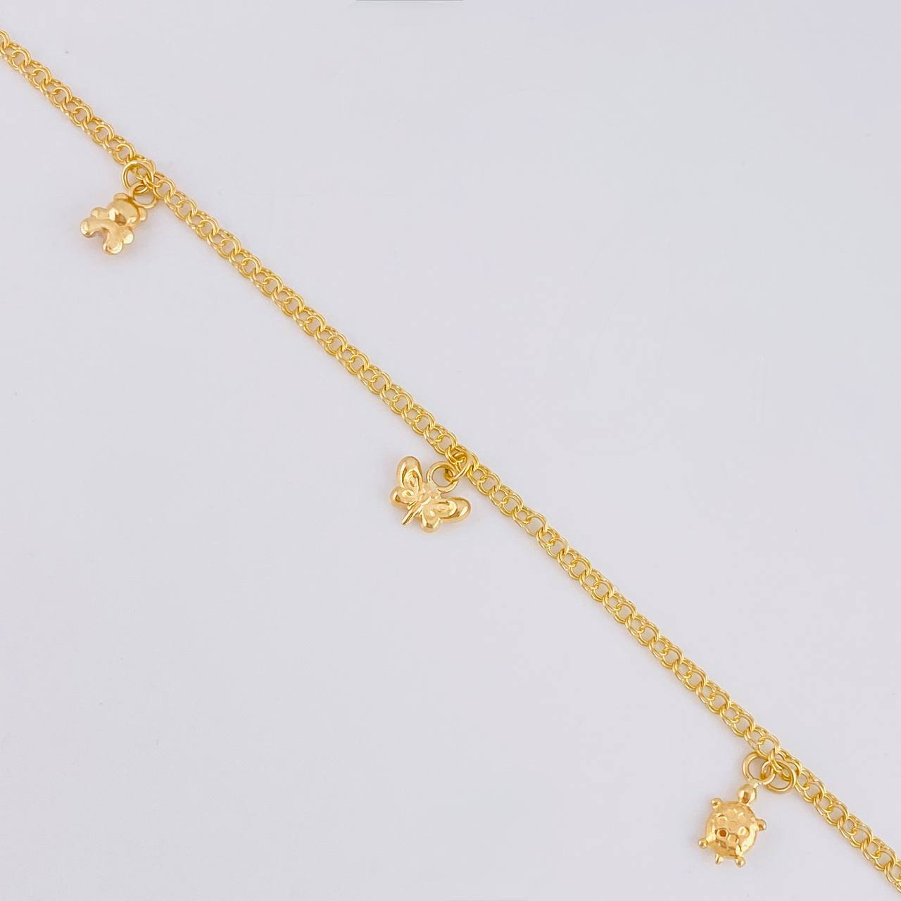 Tobillera Roll On Dijes 3.6 g / 25.6 cm / 2.3 mm Oro Amarillo 18K