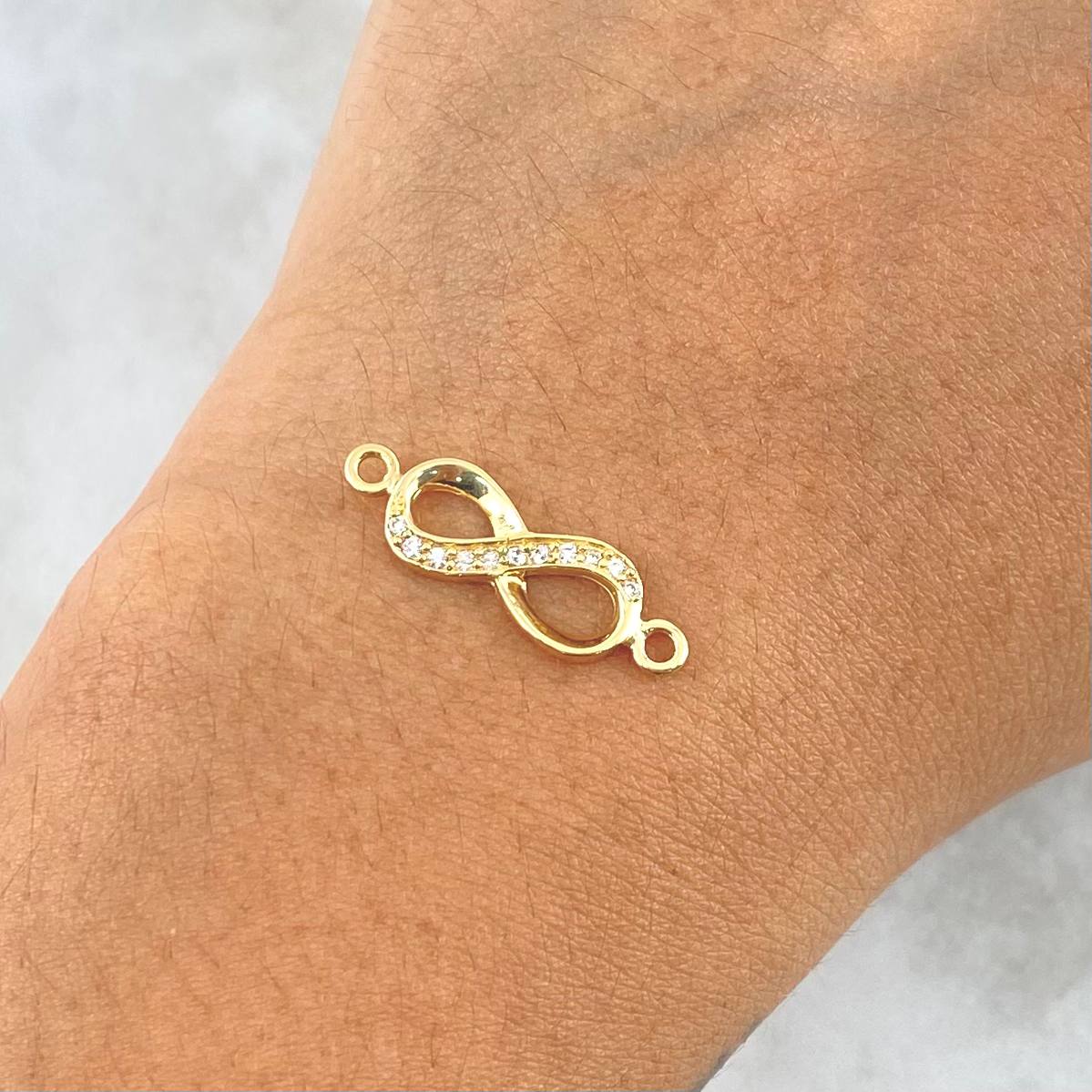 Herraje Infinito 1.05gr / 2cm / Circones Blancos Oro Amarillo 18K