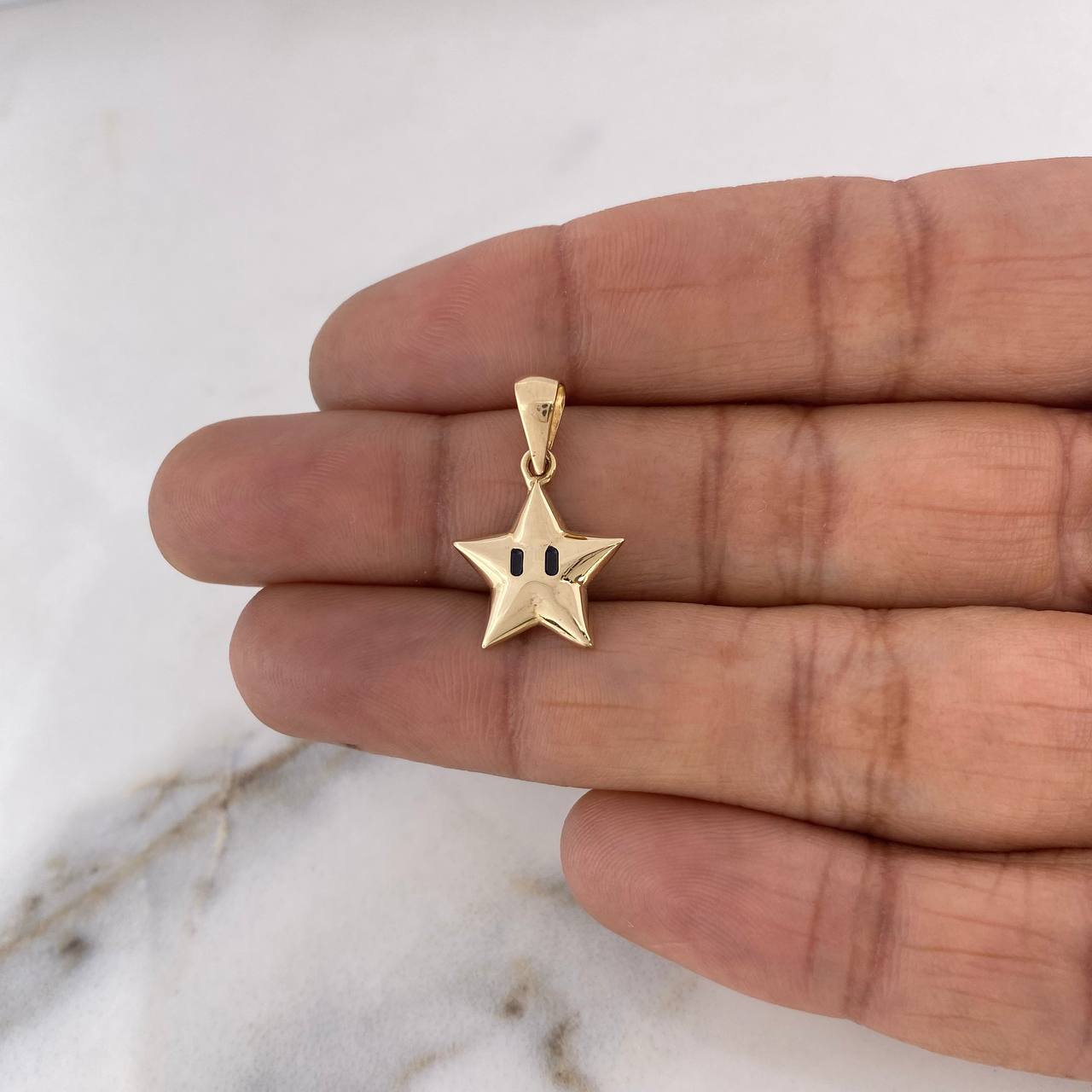 Dije Estrella  1.3gr / 2.1cm / Oro Amarillo 18K $