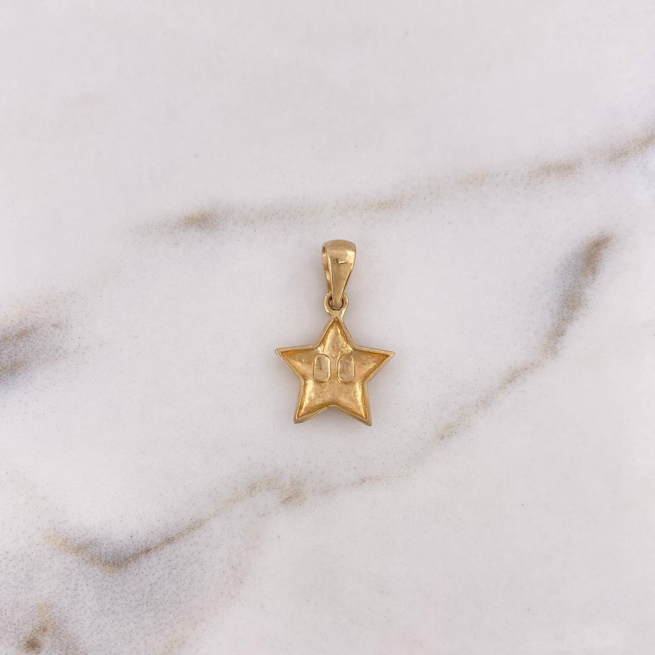 Dije Estrella  1.3gr / 2.1cm / Oro Amarillo 18K $